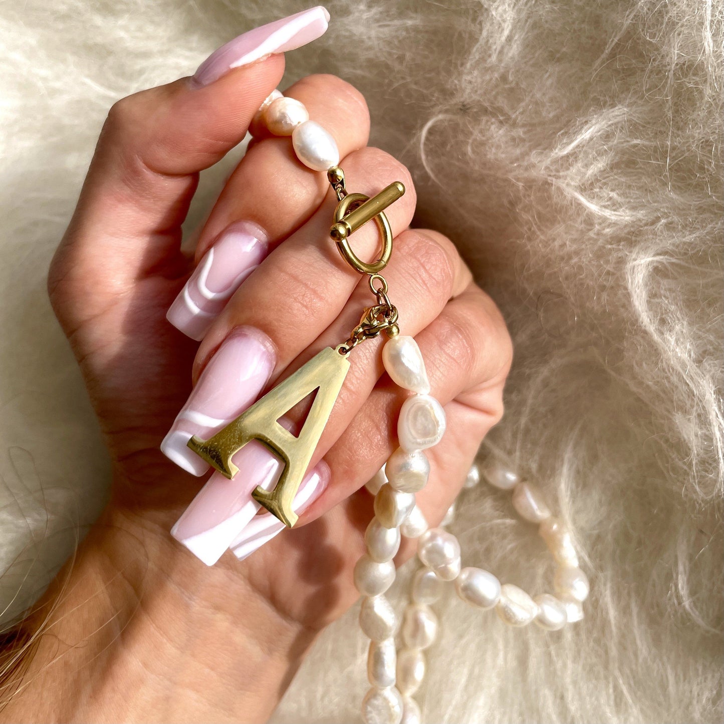 Collana di perle iniziali